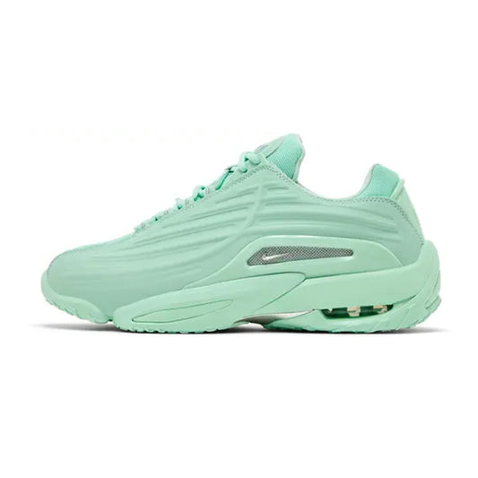 Lateral profile view of the Nike Hot Step 2 Drake NOCTA Mint Foam sneaker showcasing its monochromatic mint green molded upper, silver chrome side Swoosh accent, and visible heel Air unit.