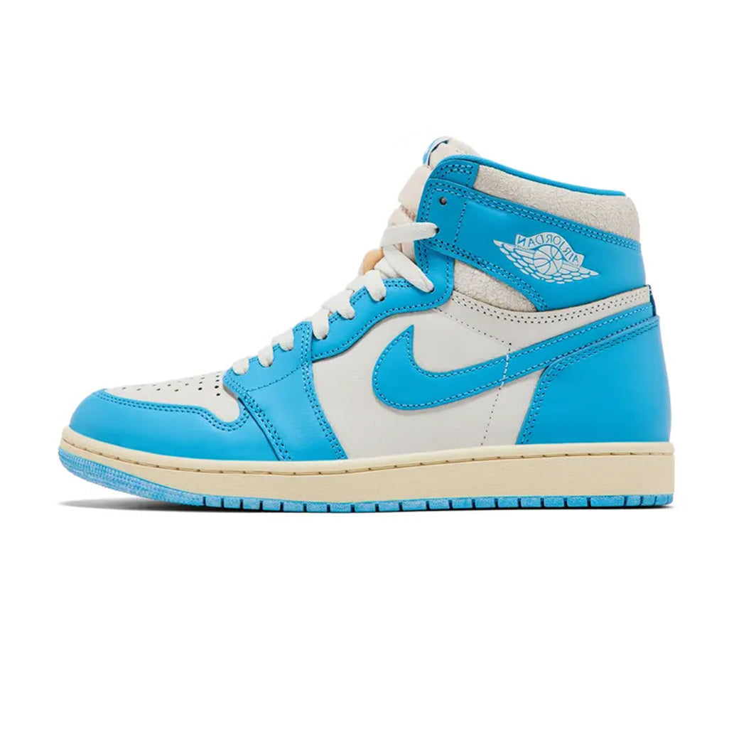 Lateral profile view of the Jordan 1 Retro High OG UNC Reimagined sneaker featuring a sail leather base, university blue overlays, white Wings logo on the collar, aged sail midsole, and blue rubber outsole.