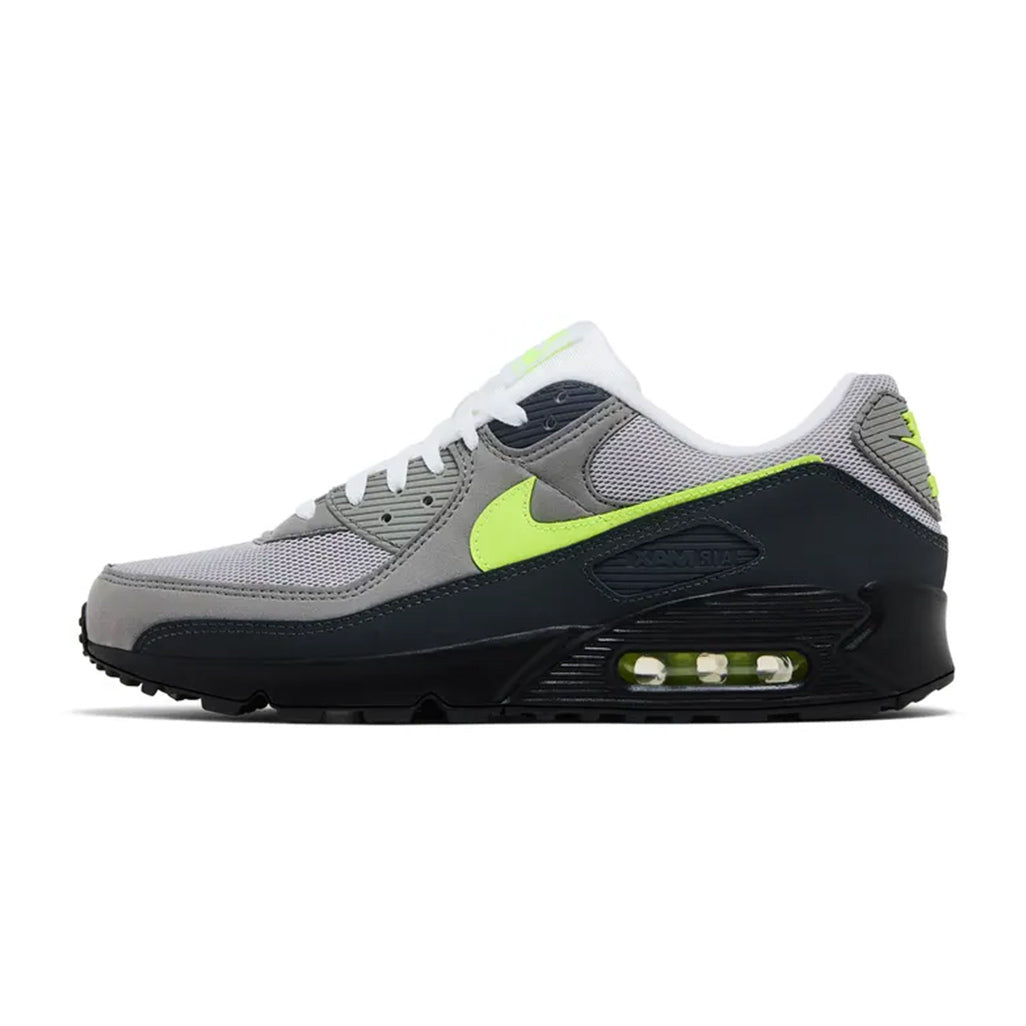 Lateral profile view of the Nike Air Max 90 Neon sneaker featuring a grey mesh and leather upper, bright volt Swoosh, dark grey and black overlays, black midsole, and visible volt Air unit.