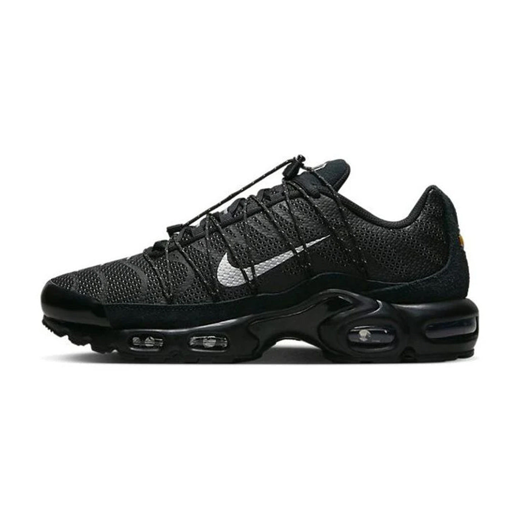 Lateral side view of the Nike Air Max Plus Toggle Black Reflective sneaker featuring a black mesh upper, toggle cord lacing, silver metallic Swoosh, black TPU wave overlays, and a black Tuned Air cushioned sole.