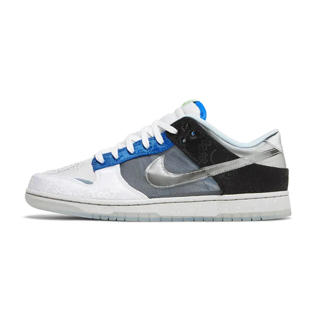 Lateral profile view of the Nike Dunk Low SP What The CLOT sneaker showcasing a mismatched design with translucent toe panels, silver metallic Swoosh, black and white overlays, and a semi-translucent rubber sole.
