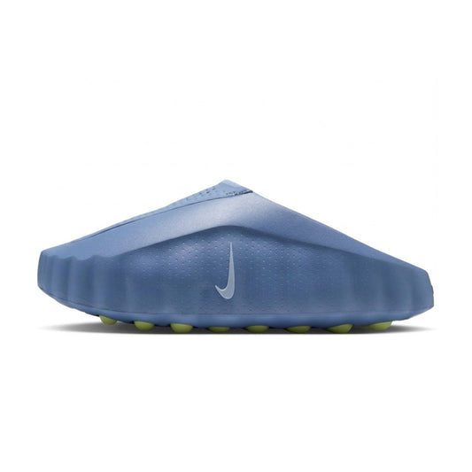 Side view of the Nike Nike Mind 001 Slide in Work Blue showing its molded foam upper, subtle silver Nike Swoosh logo, and green pod-textured outsole.