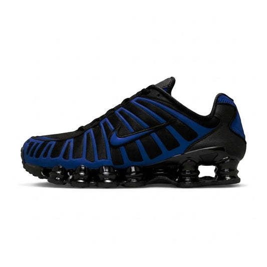 Lateral profile view of the Nike Air Shox TL Reflective Court Blue sneaker featuring a black mesh upper, bright court blue TPU wavy cage, black Swoosh, and black full-length Shox cushioning columns.
