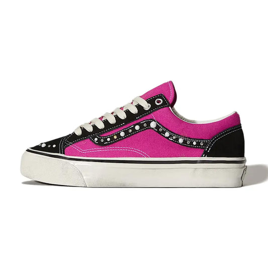 Lateral profile view of the Vans OTW Old Skool 36 Pearlized Pack Pink Black sneaker featuring a pink canvas base, black suede overlays, pearlized studs along the Sidestripe, and an antiqued vintage rubber midsole.